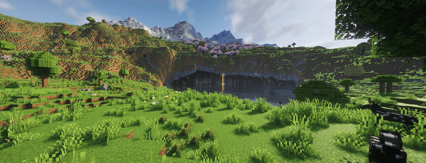 a snow-covered mountain sits atop a cherry-blossom forest with rolling green hills at the sides and a flooded cave leading  under and through it all.