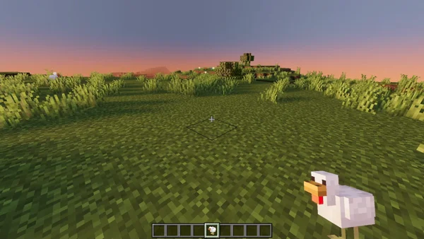 Sneak and use the item on a block to place the mob back down
