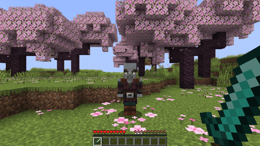 Hitting a pillager with a diamond sword, the damage numbers bouncing off it