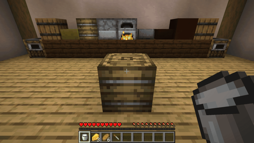 Filling the butter churn with milk and turning the handle until it hands over two butter
