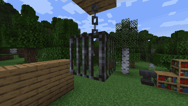 Putting a filled pokeball and spawn eggs in a cage to show off the mob inside