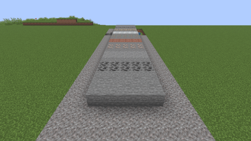 One extruder drilling a trench through stone and ore while two more lay walls behind themselves