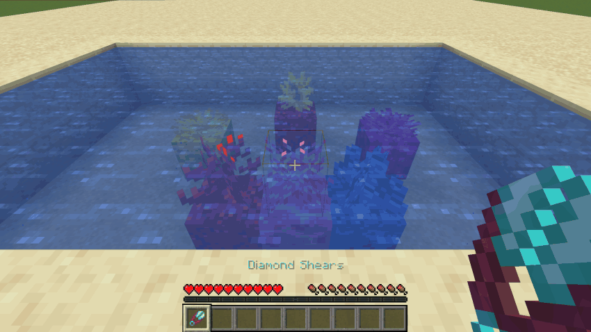 Shears with Coral Cutter clipping coral out of a reef pool, every piece dropping itself to keep