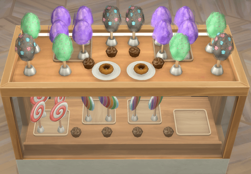 Image of the display case filled with candy and cupcakes. Credit to Waffle for this image.