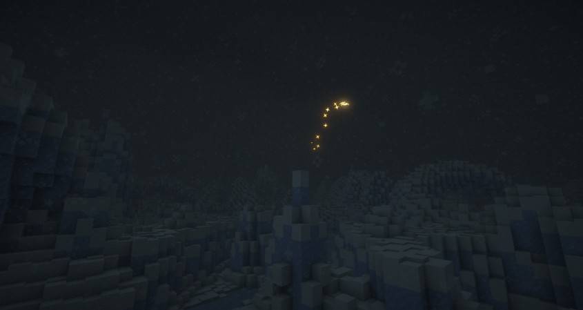 A lone golden moth flies through the darkness.