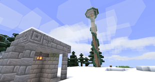 The entrance of an underground village next to a tower