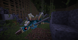 A Kentrosaurus sleeps in its enclosure.