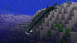 A barracuda with a mackerel in its mouth