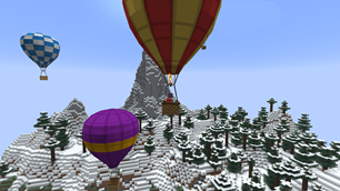 Hot-air balloons among the peaks, the burner roaring