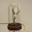 A decorative wilted  cowplant statue logo