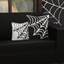 Cozy Cobweb Pillow logo