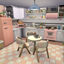 Cluttered Pastel Retro Kitchen logo