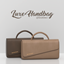 Emdoescc | New Luxe Handbag Clutter logo