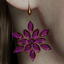 Noel Snowflake Earrings logo