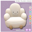 Nomi plush chair logo