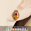 Amber Veil Earrings logo