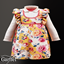 Infant - Floral ruffle pinafore layered over a collared blouse logo