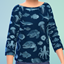 A cozy long-sleeve sweater for boys featuring a detailed all-over ocean life and sea creature pattern. logo