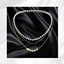 Gold Pearl fish layered necklace logo