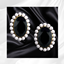 Midnight Pearl Statement Earrings logo