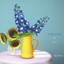 Delphinium flower in vase logo