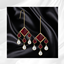 Ruby Dangle Earrings logo