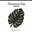 DESIGN ESSENTIALS l Monstera Leaf Rug 2 logo